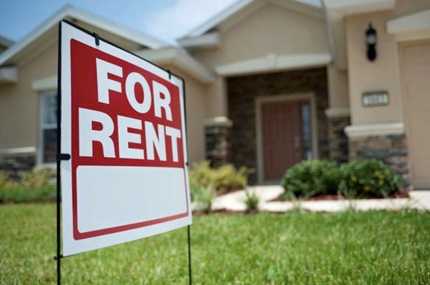 For rent sign in front of single family home